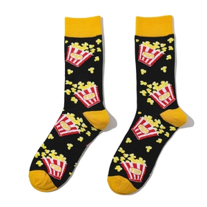 Close-up of cotton crew socks featuring creative red and white popcorn pattern design