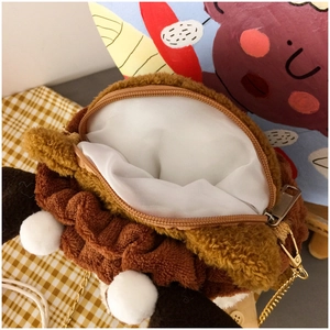 Close-up of squirrel plush crossbody bag with zipper opening and gold chain strap