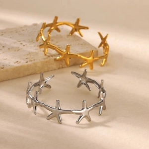 Minimalist starfish open cuff bracelet in gold and silver finish with ocean theme design
