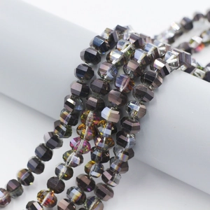 Macro view of 8mm faceted dark grey crystal beads with iridescent coating for jewelry