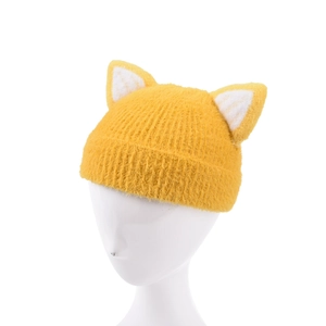 Close-up of cute fox ear details on yellow knitted winter beanie for kids