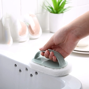 Green ergonomic handheld cleaning brush with white scouring sponge for bathroom and kitchen