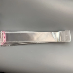 Transparent long plastic self-sealing bags with red adhesive strips and hanging holes
