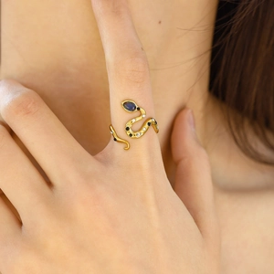 Elegant 18K gold snake ring with blue zircon drop gemstone and pavé crystal accents