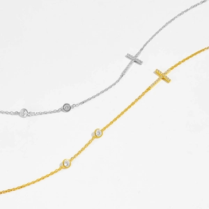 Elegant 18K gold and silver cross necklaces with round diamond accents for women