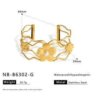 Detail view of 18K gold plated hollow floral cuff with dimensions and stainless steel texture