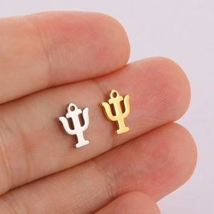 Golden and silver Greek letter Psi charms shown on a fingertip for size comparison