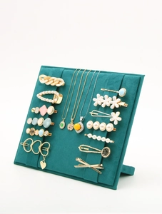 Deep green velvet jewelry display stand for hair clips and headbands with slanted design