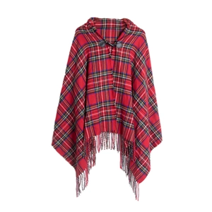 Detail of red tartan plaid hooded cloak featuring horn buckle and fringe trim edge