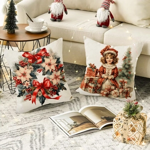 Close-up of linen Christmas pillow covers featuring vintage Santa and floral holiday prints