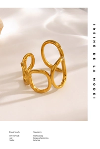 Detailed view of irregular multi-layer gold ring with organic hollow design and polished finish