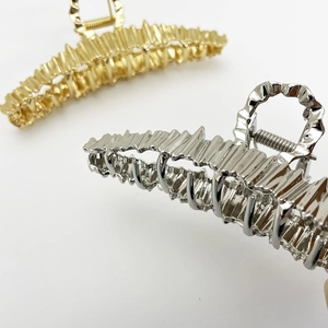 Irregular metal shark hair clips in gold and silver with stylish wavy textures