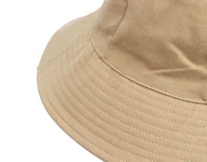 Close-up of precise stitching and premium cotton twill texture on khaki sun hat brim