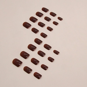 Deep reddish brown press-on nails in short square shape with a glossy finish