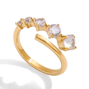Golden titanium steel open ring featuring five graduated round cubic zirconia stones