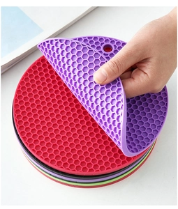 Macro shot showing flexible purple silicone honeycomb coaster for heat resistance