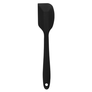 Close-up of a black silicone cake spatula with ergonomic handle and hanging hole