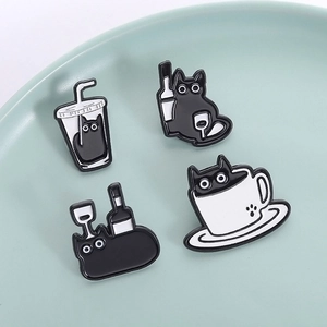Set of four cute black cat enamel pins featuring coffee cups and bottles on a dish