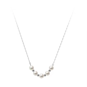 Minimalist silver chain necklace with five round white pearls and delicate metal spacers