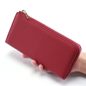 Women's long red leather RFID wallet with litchi grain texture and gold zipper detail
