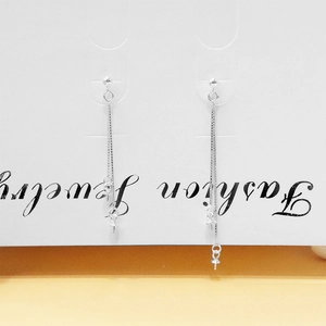 Detail of S925 sterling silver ball stud earrings with long double box chain tassels