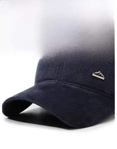 Detail of navy herringbone knit baseball cap with sport metal logo and firm brim