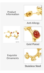 Macro view of gold plated stainless steel hoop earrings with pearls and red beads
