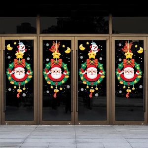 Christmas window decals with Santa, reindeer and wreaths on glass doors for shop decor