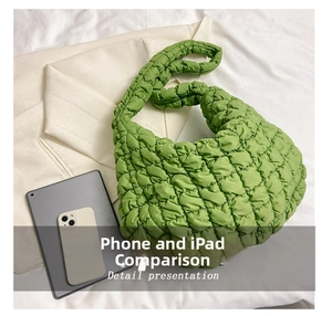 Size comparison of large quilted puff shoulder bag in grass green with iPad and phone