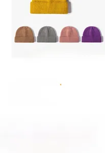 Close-up detail showing various colors of stylish knitted winter beanies for adults