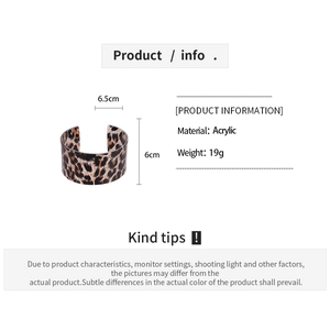 Detailed view of leopard print acrylic C-shaped open cuff bracelet with dimensions info