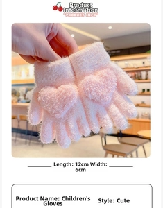 Detailed view of pink plush toddler gloves featuring a 3D heart design and soft fuzzy texture