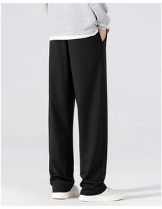 Detail view of the back and side profile of men's loose straight-leg casual trousers