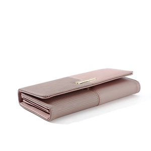 Side view of long pink patchwork wallet showing accordion structure and metal buckle
