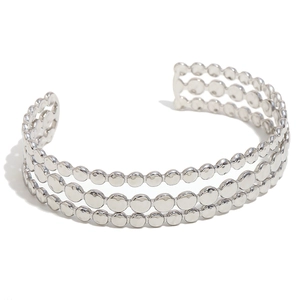 Minimalist silver triple-layered metal cuff bracelet with polished bead design on white background