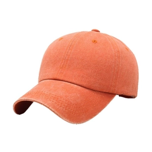 Vintage washed orange cotton baseball cap with distressed texture on white background