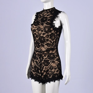 Detailed view of the intricate floral lace texture and hollow out pattern on the black romper