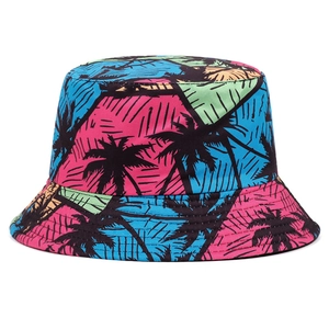 Detail view of the colorful tropical palm tree pattern and geometric prints on this bucket hat