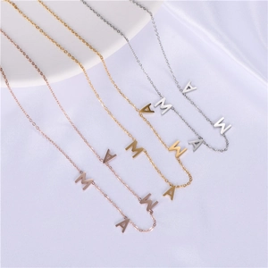 Detailed view of MAMA letter necklaces in rose gold, gold, and silver stainless steel