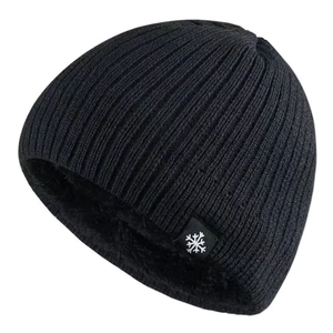Detailed view of black knit beanie with thick thermal fleece lining and snowflake tag