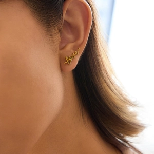 Elegant gold Love script stud earrings for women with polished stainless steel finish