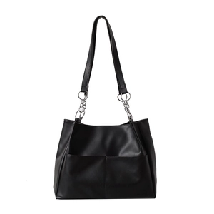 Minimalist black PU leather tote bag with front pockets and stylish metal chain strap