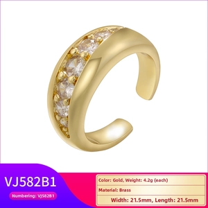 Detail of 21.5mm gold brass geometric ring with five sparkling cubic zirconia stones