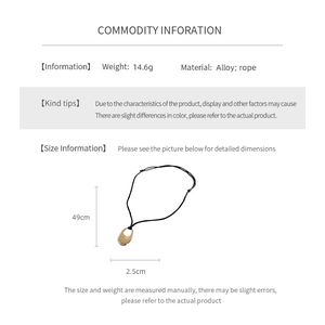 Detailed view of oval gold alloy pendant on black rope showing weight of 14.6 grams