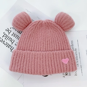 Pink knitted bear ear beanie for women with cute heart patch and warm earflaps
