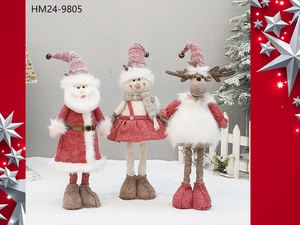 Detailed view of plush Christmas figures including Santa, snowman and reindeer on a snowy base