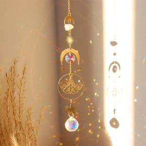 Macro detail of brass moth suncatcher casting colorful rainbow light spots on wall