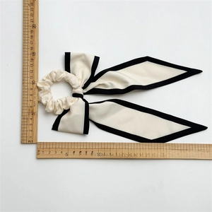 French style cream satin oversized bow hair tie with black edges and size measurements
