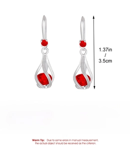 Macro detail of red zircon drop earrings with alloy silver finish and dimensions