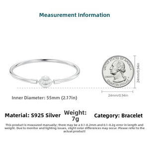S925 sterling silver shell bracelet with 55mm inner diameter shown next to a coin for scale